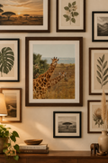 a vertical photograph of two giraffes peeking around to see whats happening around them. perfect print to bring in patterns and color to any space.