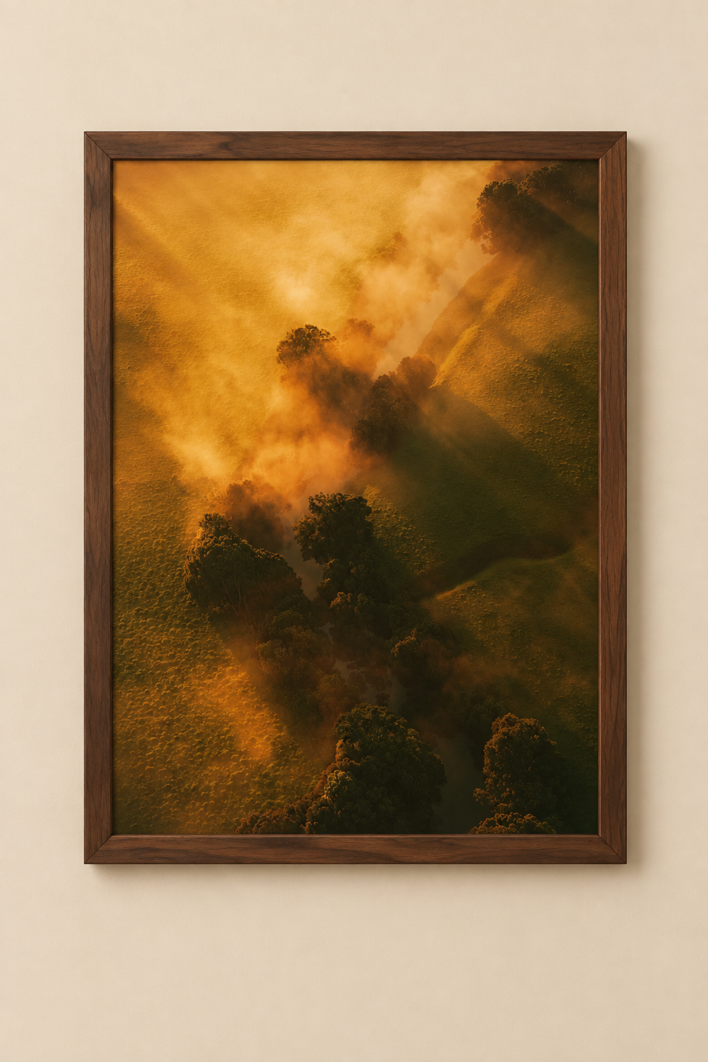 A vertical landscape art print depicting a misty forest scene with dramatic golden sunlight filtering through fog and casting long shadows over dark trees, shown as a mockup on a white background with a drop shadow.
