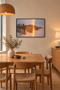 Sand dune film photograph without a white border in a thin black frame in a warm dining room