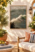 Sea spray ocean photograph without a white border in a wooden frame on a sunny patio