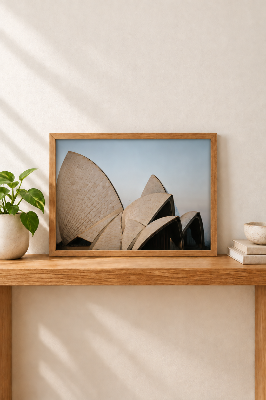 Horizontal framed Sydney Opera House photograph without white border in a vertical console setting